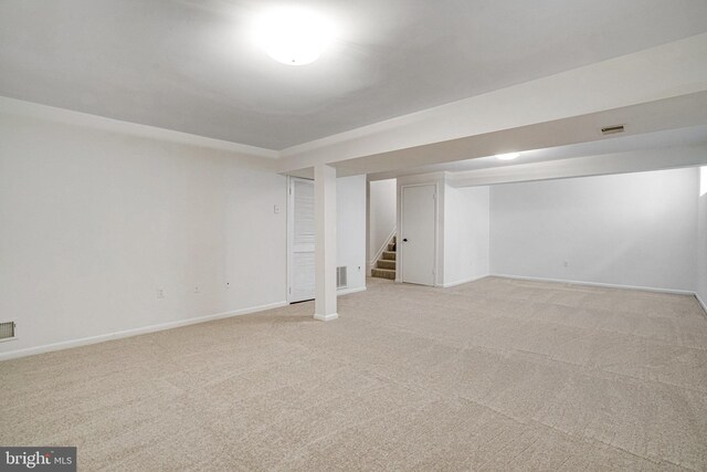 9103 Home Guard Dr, Burke, VA 22015 - finished basement with stairway, light colored carpet, and baseboards