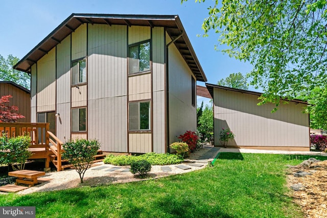 9103 Home Guard Dr, Burke, VA 22015 - rear view of property with a deck, a lawn, and an outbuilding