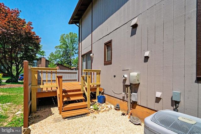 9103 Home Guard Dr, Burke, VA 22015 - view of property exterior featuring a wooden deck and central AC