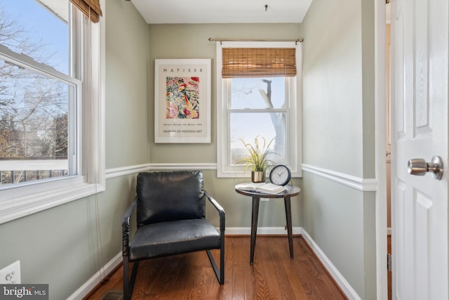 sitting room with hardwood / wood-style flooring