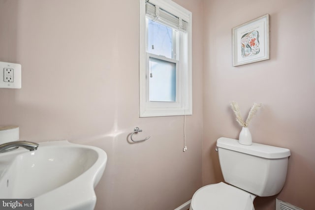 bathroom featuring sink and toilet