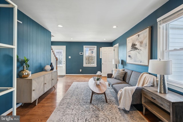 living room with hardwood / wood-style flooring and a wealth of natural light