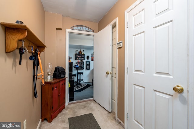 hallway with light carpet