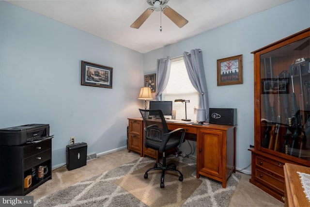 office area featuring ceiling fan and light carpet