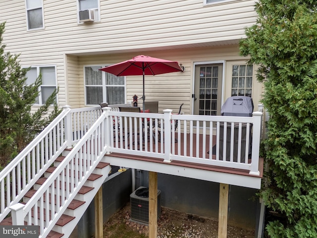 wooden deck featuring central AC and cooling unit