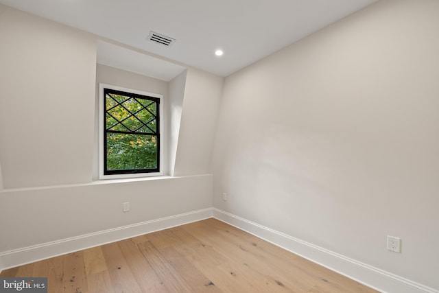 spare room featuring light hardwood / wood-style flooring