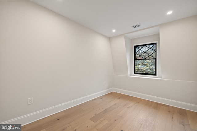 unfurnished room with light hardwood / wood-style floors