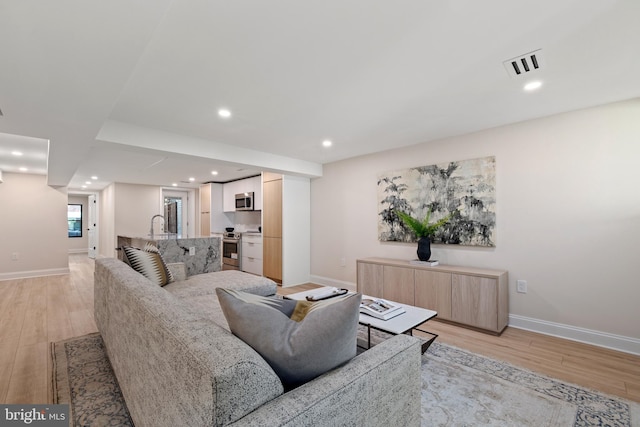 living room featuring light wood-type flooring