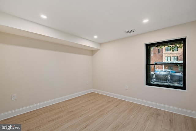 unfurnished room featuring light hardwood / wood-style floors