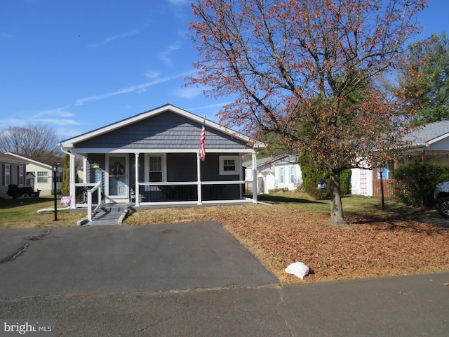 bungalow-style home featuring covered porch