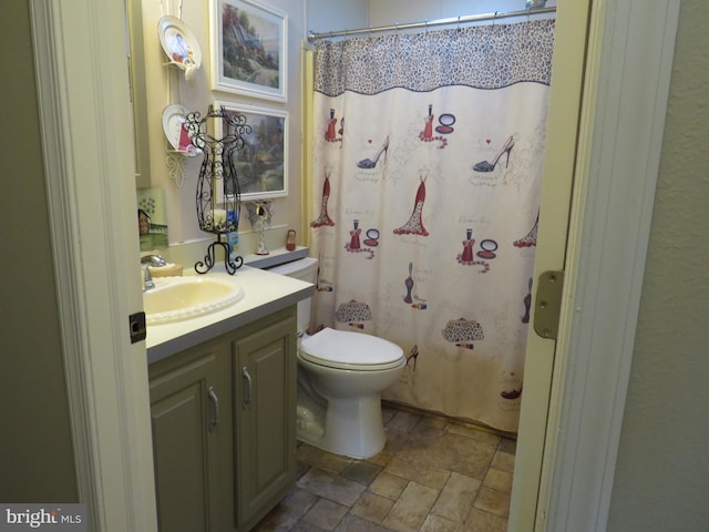 bathroom with vanity, toilet, and a shower with curtain