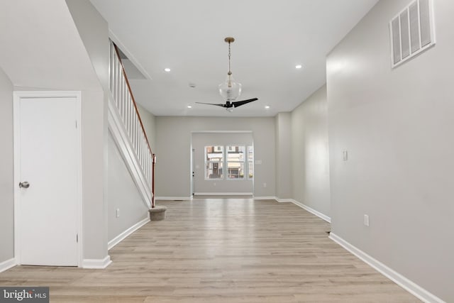 entrance foyer with ceiling fan and light wood-type flooring