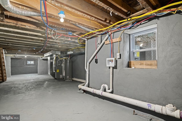 basement featuring heating unit and water heater