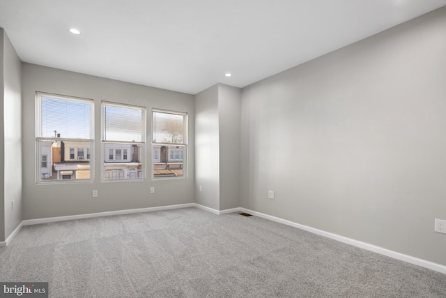 unfurnished room featuring carpet floors