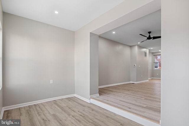 spare room with ceiling fan and light hardwood / wood-style flooring