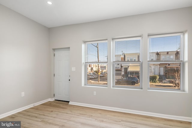 spare room with light hardwood / wood-style flooring