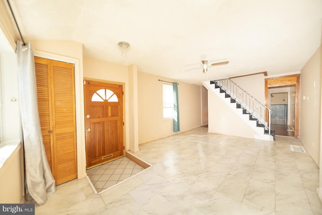 foyer featuring ceiling fan