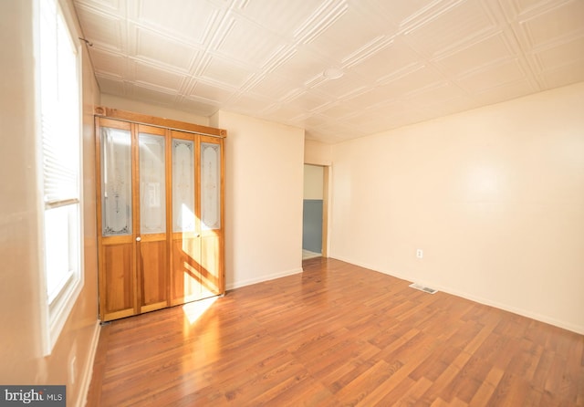 spare room featuring hardwood / wood-style flooring