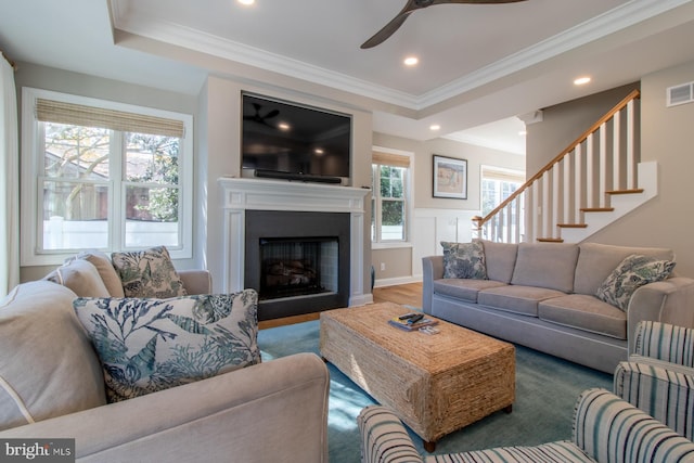 living room featuring ornamental molding and hardwood / wood-style floors