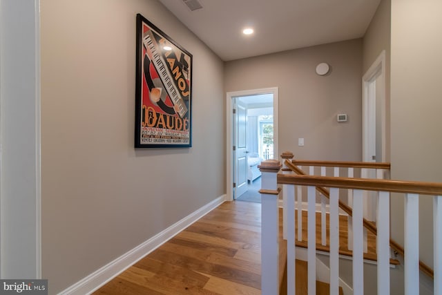 hallway with light hardwood / wood-style flooring