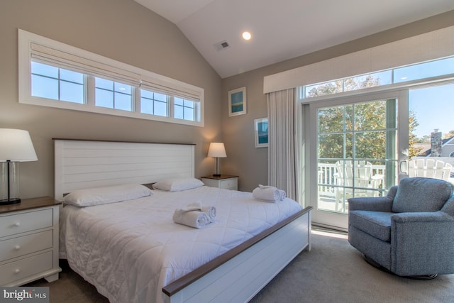 bedroom featuring access to exterior, vaulted ceiling, and carpet floors