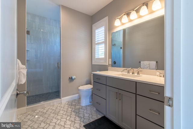 bathroom featuring vanity, a shower with shower door, toilet, and tile patterned flooring