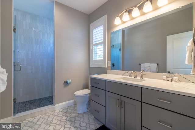 bathroom featuring vanity, an enclosed shower, toilet, and tile patterned floors