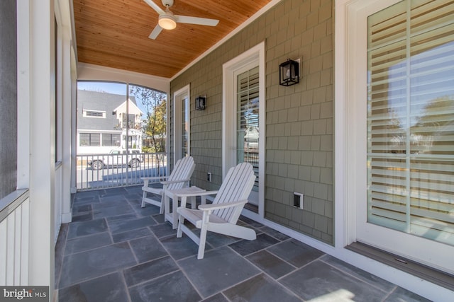 view of patio with a porch and ceiling fan