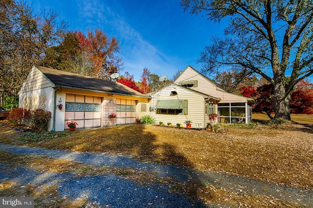 view of front of house with a sunroom