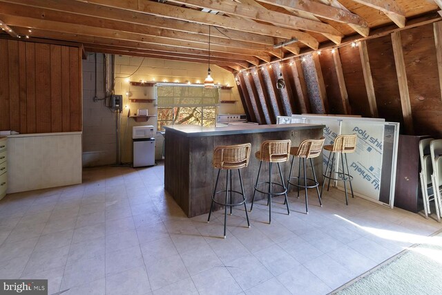 bar with pendant lighting and white range