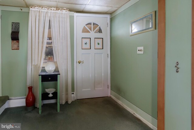 entryway with carpet and a drop ceiling