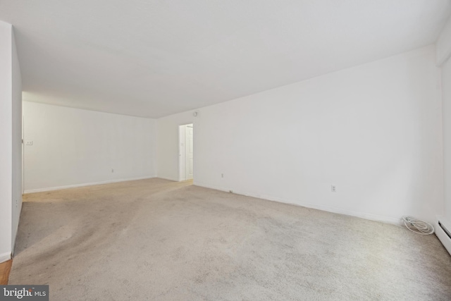 empty room featuring light colored carpet