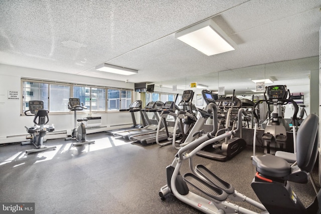 workout area featuring a textured ceiling