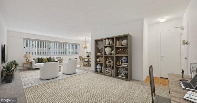 carpeted living room with baseboard heating and an inviting chandelier