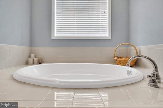 bathroom with tiled bath