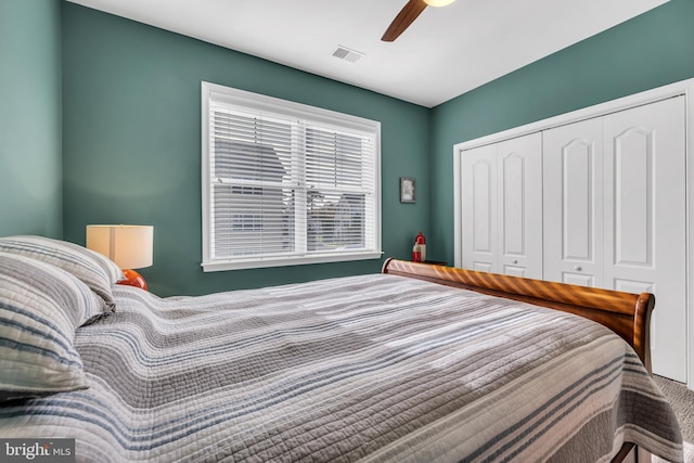 bedroom featuring ceiling fan and a closet