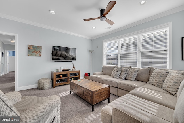 living room with ceiling fan, carpet floors, and ornamental molding