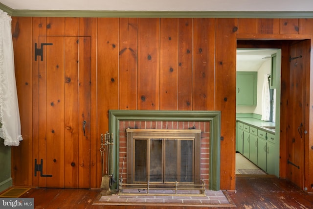 details with a fireplace and wood-type flooring