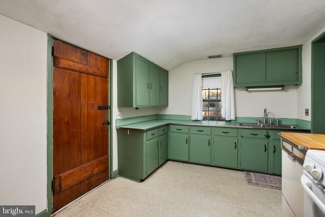 kitchen featuring sink, green cabinetry, and white range with electric cooktop