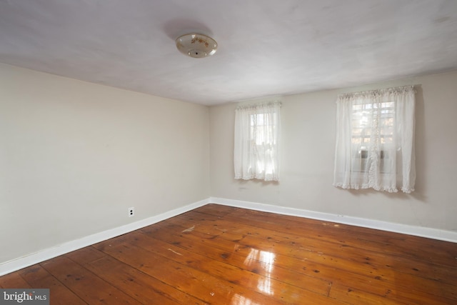 spare room featuring dark hardwood / wood-style floors