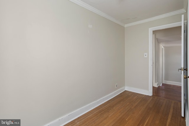 unfurnished room with dark hardwood / wood-style flooring and crown molding