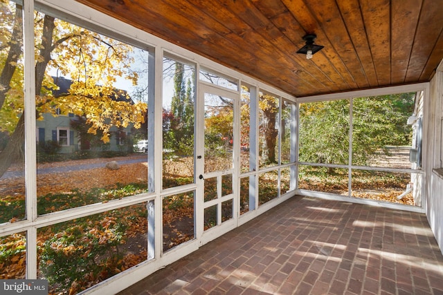 unfurnished sunroom featuring wooden ceiling