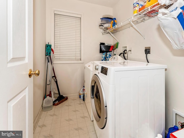 washroom with washer and clothes dryer