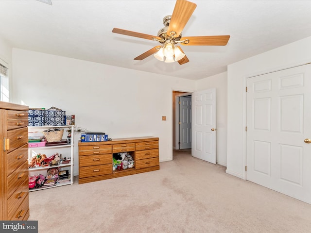 carpeted bedroom with ceiling fan