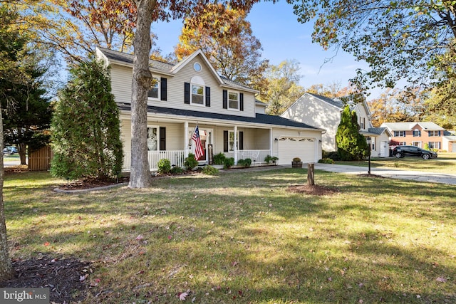 view of front property with a front yard, a porch, and a garage