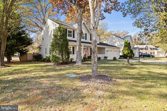 view of front property featuring a front yard and a garage