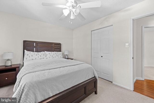 carpeted bedroom featuring ceiling fan