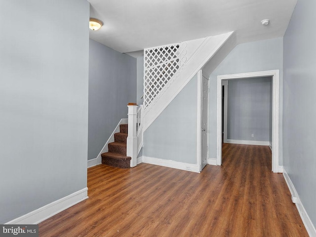 staircase featuring wood-type flooring