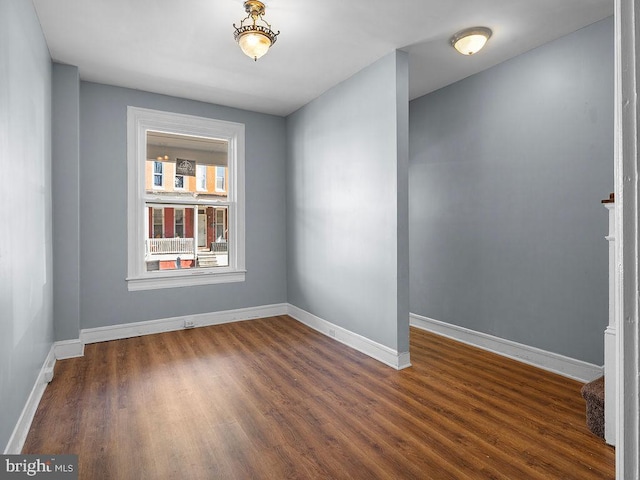 unfurnished room featuring dark hardwood / wood-style floors