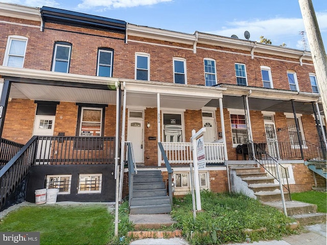 multi unit property featuring a porch